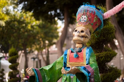 skeleton statue near tree dia de los muertos google meet background