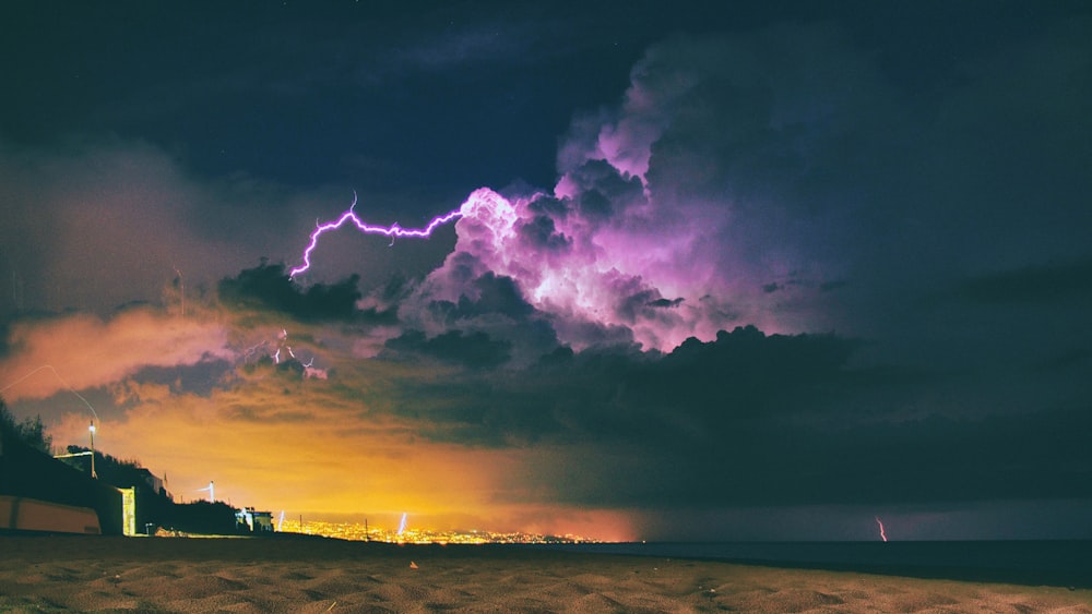 seashore under nimbus clouds