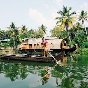 man riding on boat during daytime