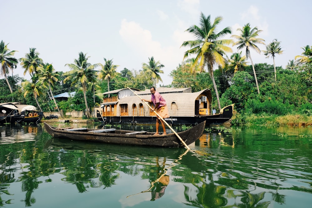 man riding on boat during daytime