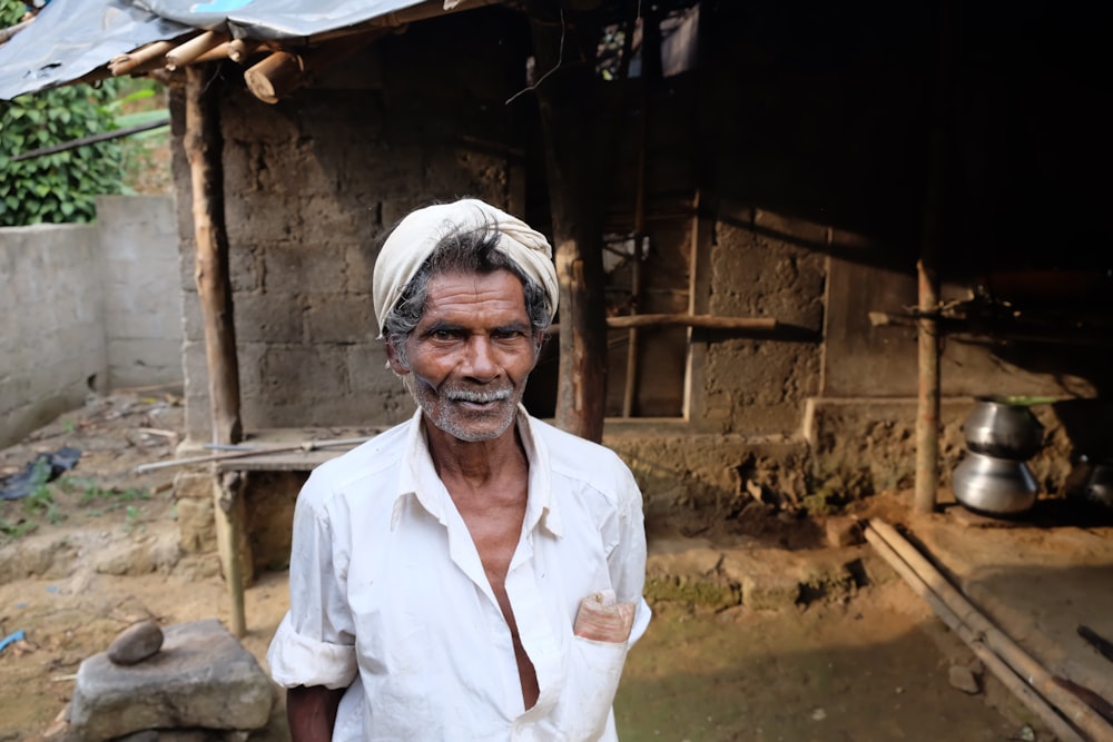 man standing in front of house