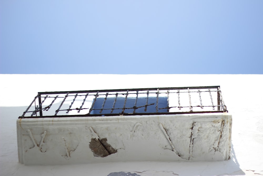 low angle photography of black metal balcony rails