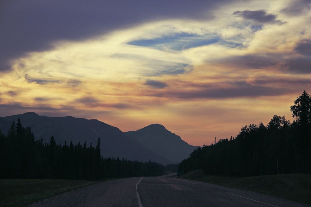 highway leading towards mountain ranges