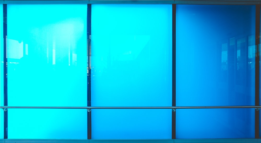 black-framed blue glass window