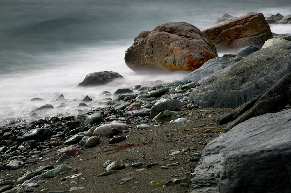 gray and brown stone covered with fog