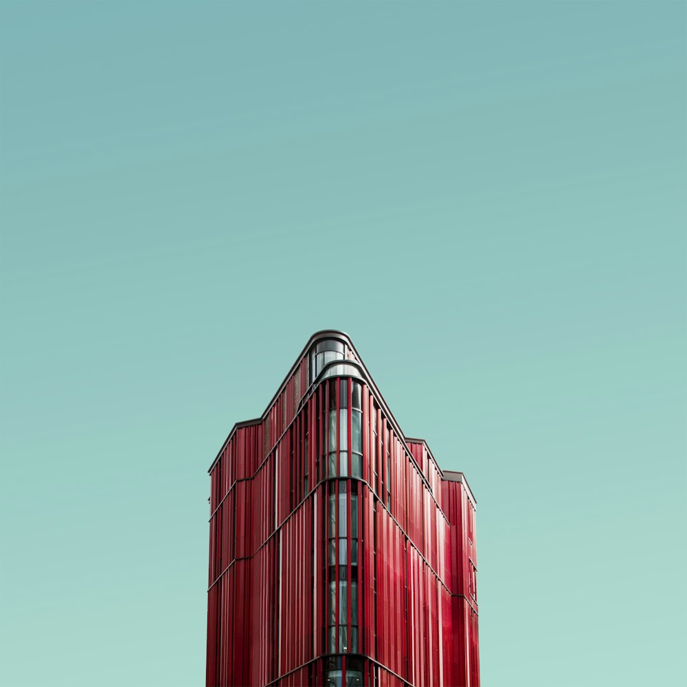 worm's eye view photography of red glass building