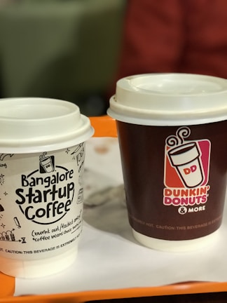 Founders Niraj Vadav and Dheeraj Kumar discussing strategy over coffee.