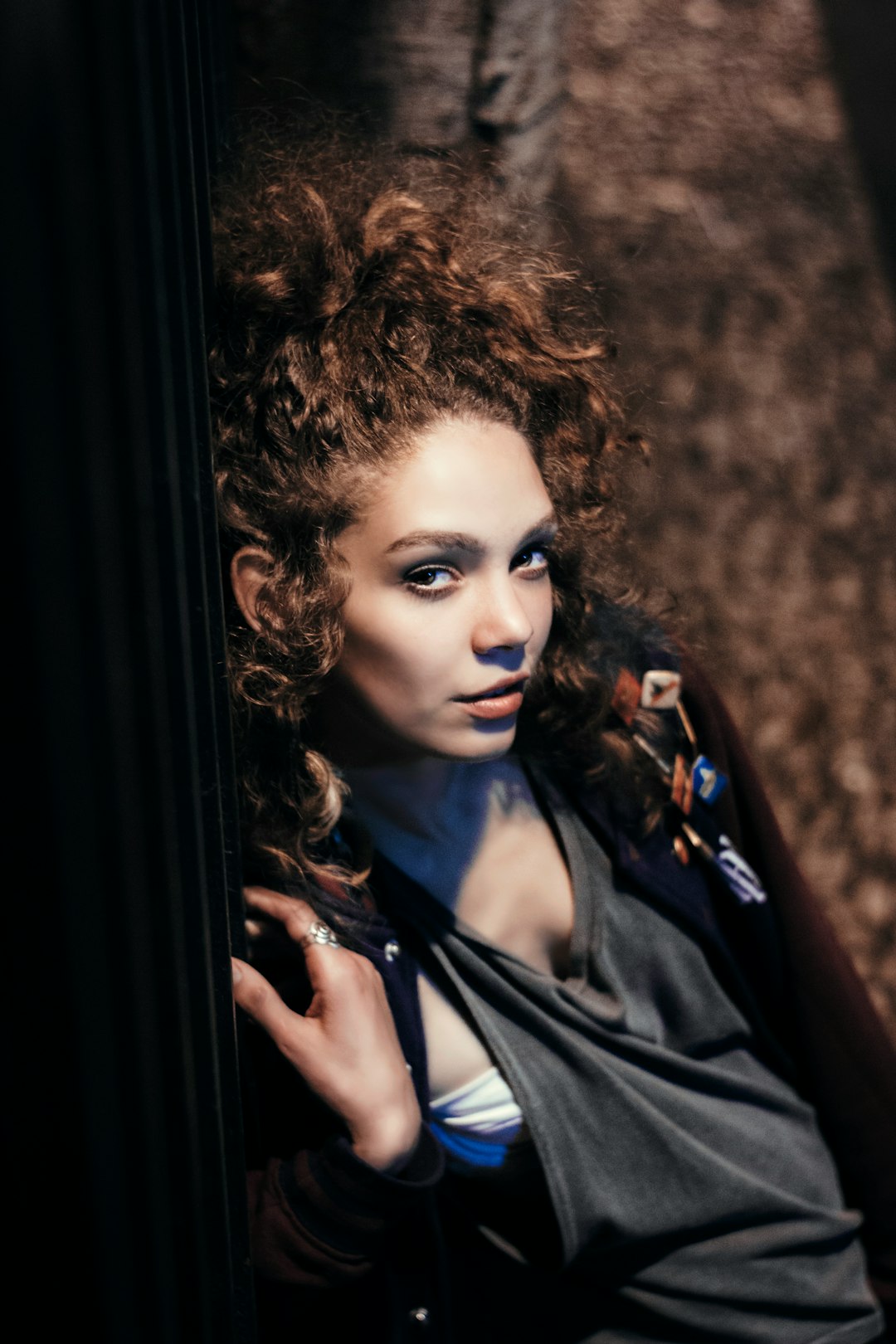 woman leaning on wall