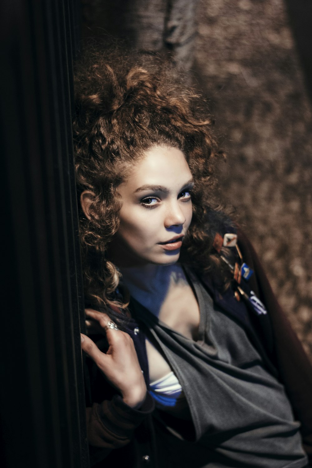 woman leaning on wall