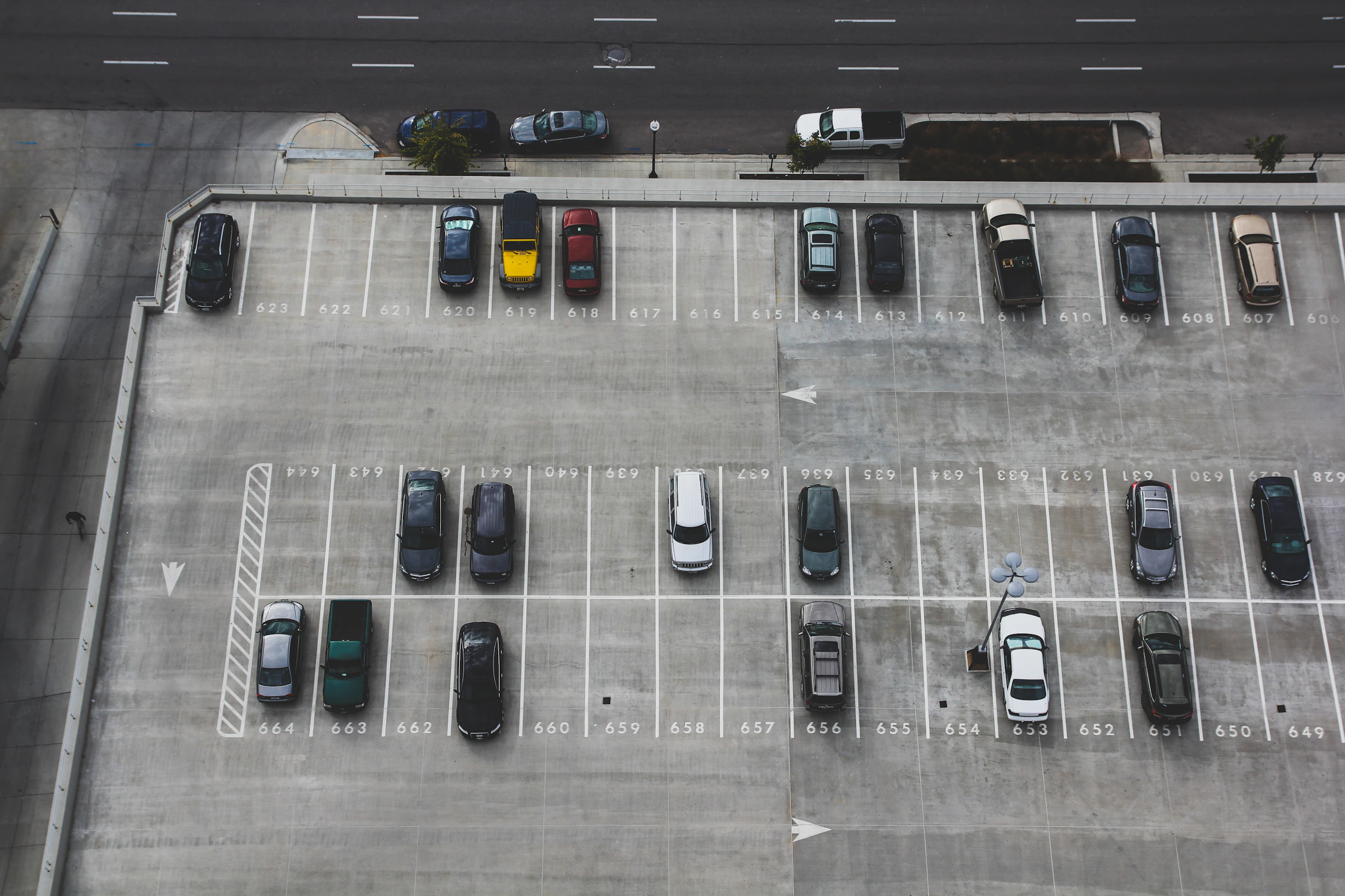 Cars parked tightly on an urban street