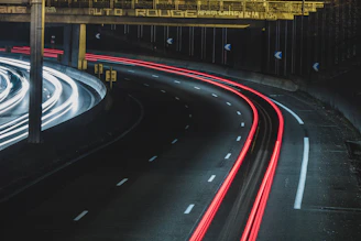 long exposure shot of cars on a road at night