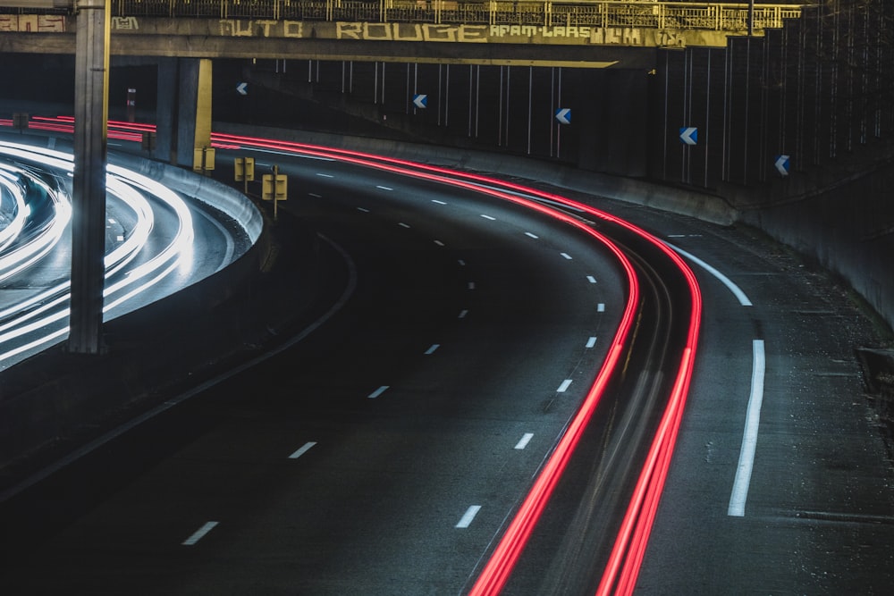 long exposure shot of cars on a road at night
