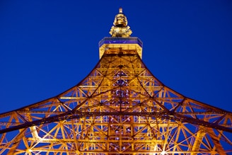 Evening shot of a completed steel structure illuminated by soft site lighting.
