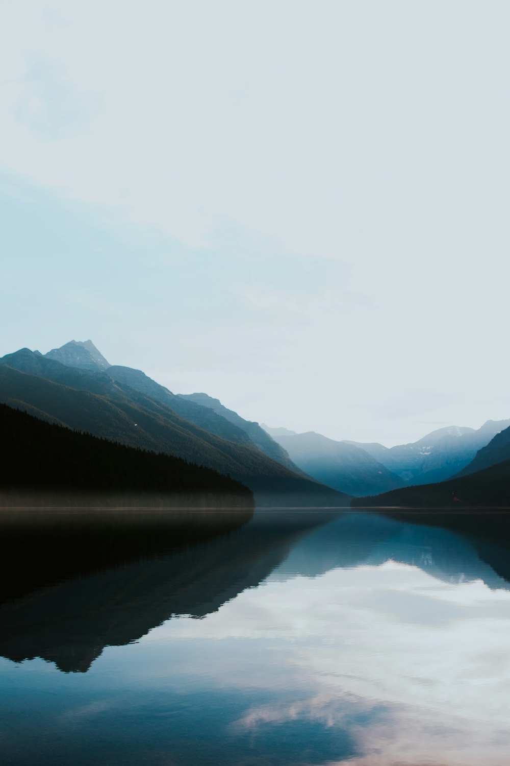 mountains surrounded by body of water