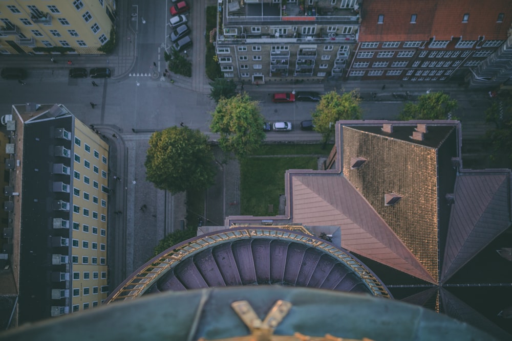 aerial view photography of vehicles near buildings