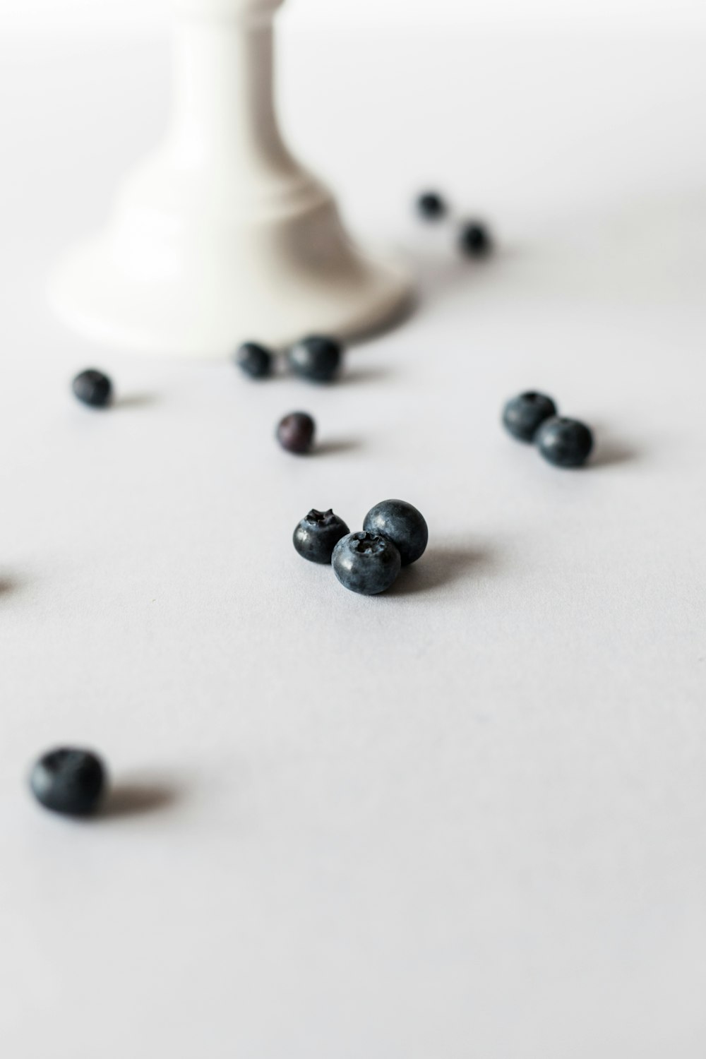 closeup photo of seed on white surface