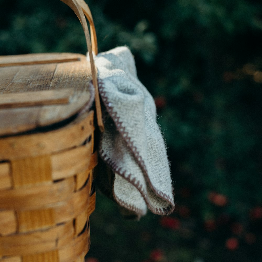 brown woven basket with white textile