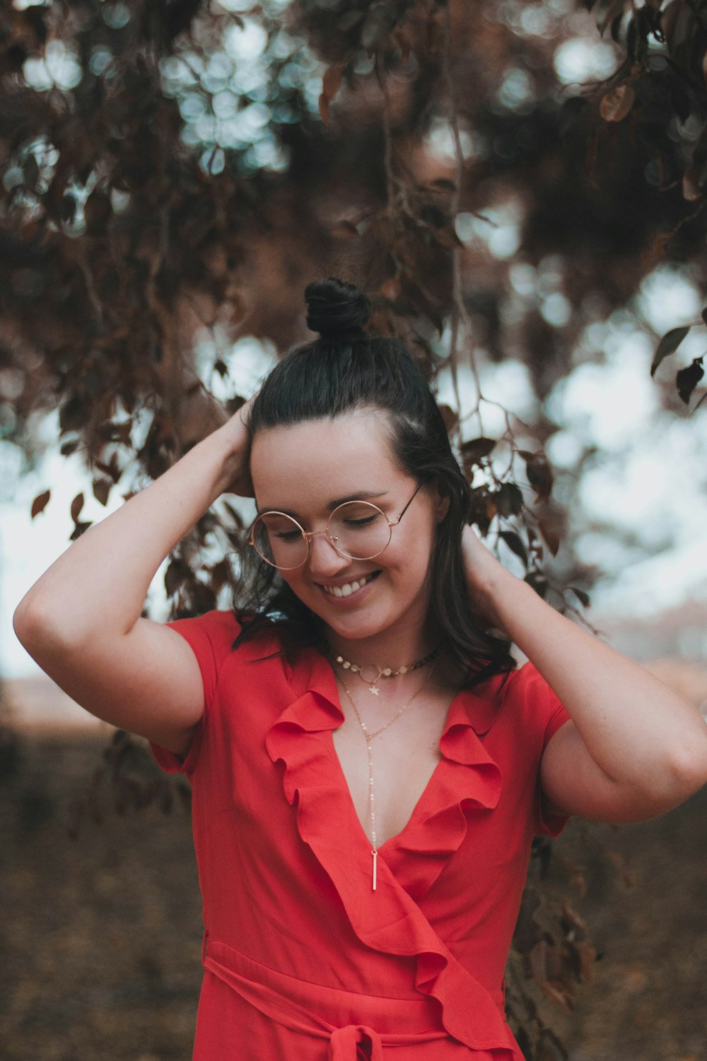 woman putting both hands his hair