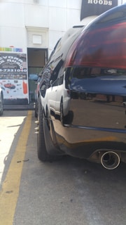 A shiny car parked on a street, symbolizing vehicle ads.