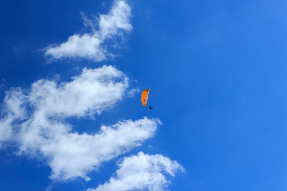 person using parachute during daytime