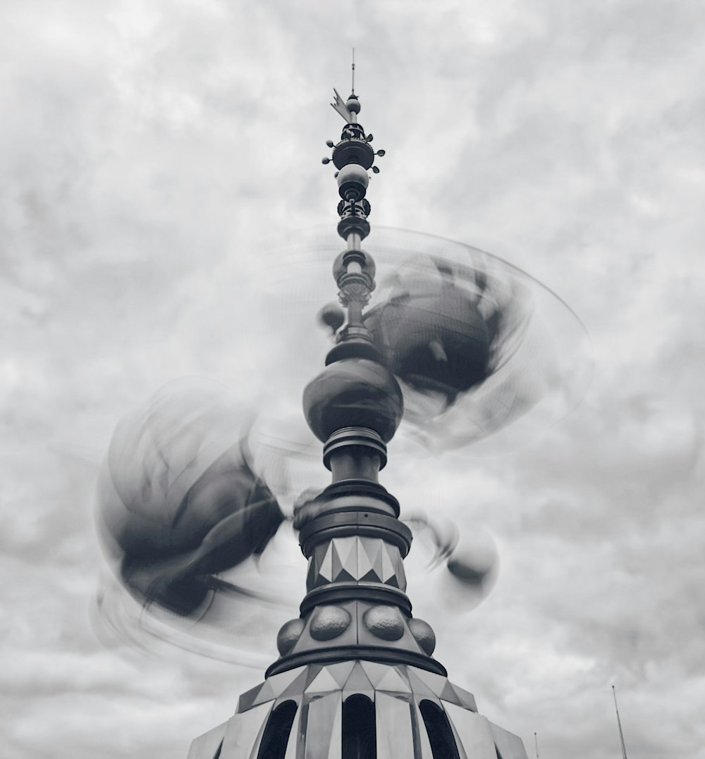 grayscale photo of spinning tower