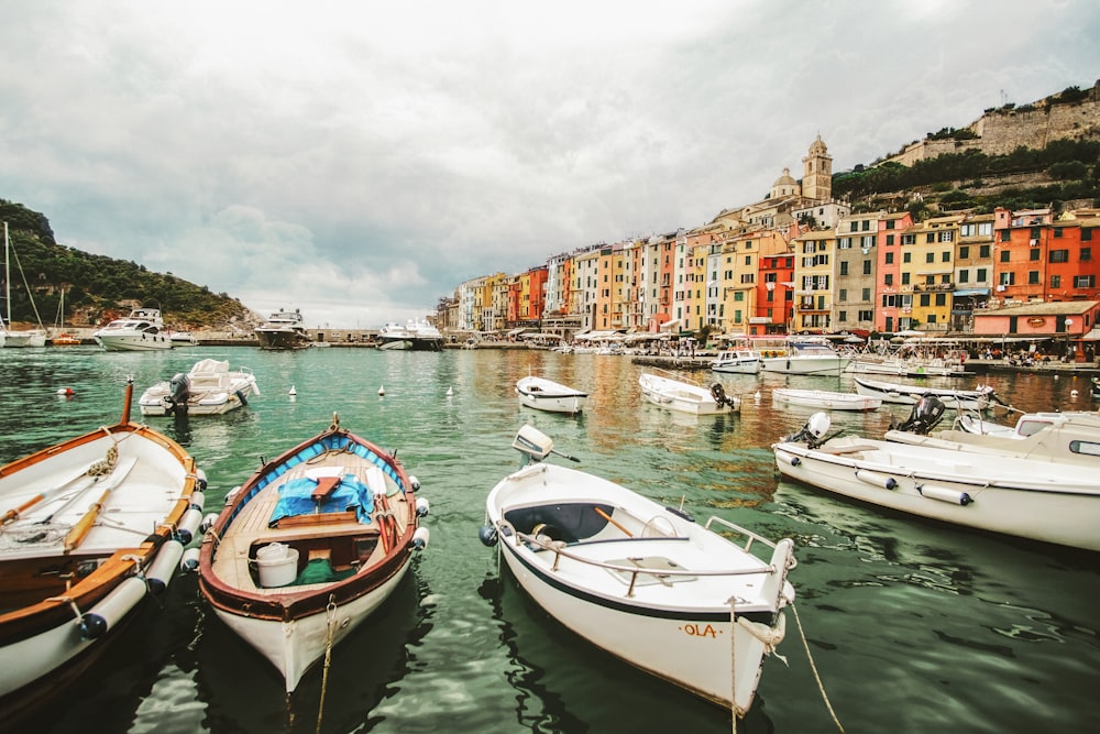 photo of boats near buildings