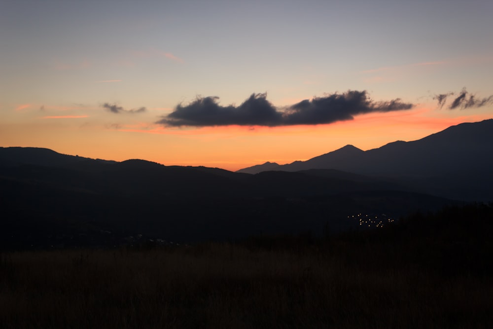 silhouette of mountain during dawn