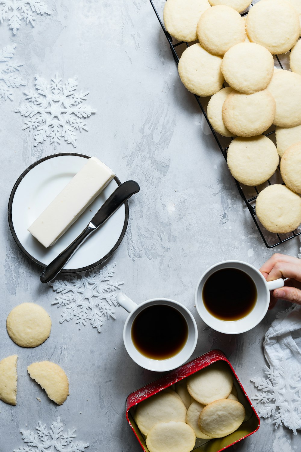 cookie lot near mug and plate