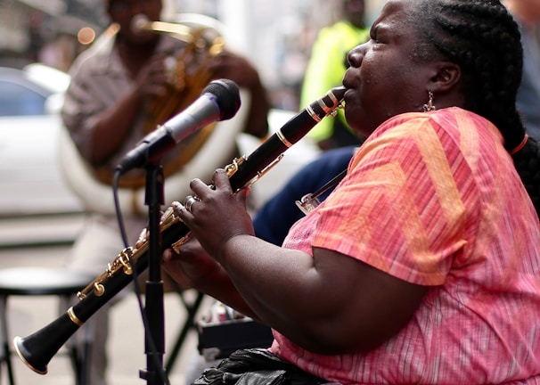 woman using black clarinet