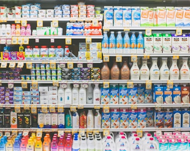 assorted drinks on white commercial refrigerator