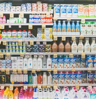 assorted drinks on white commercial refrigerator