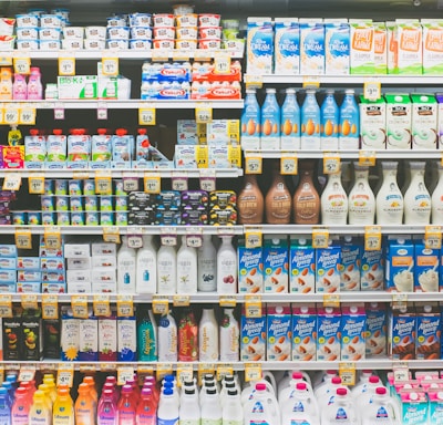 assorted drinks on white commercial refrigerator