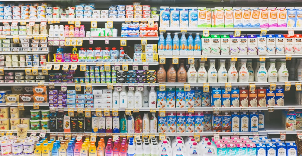 assorted drinks on white commercial refrigerator