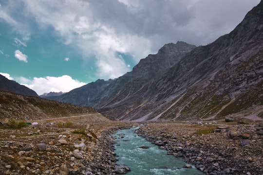 body of water near mountain at daytime in Spiti Valley India