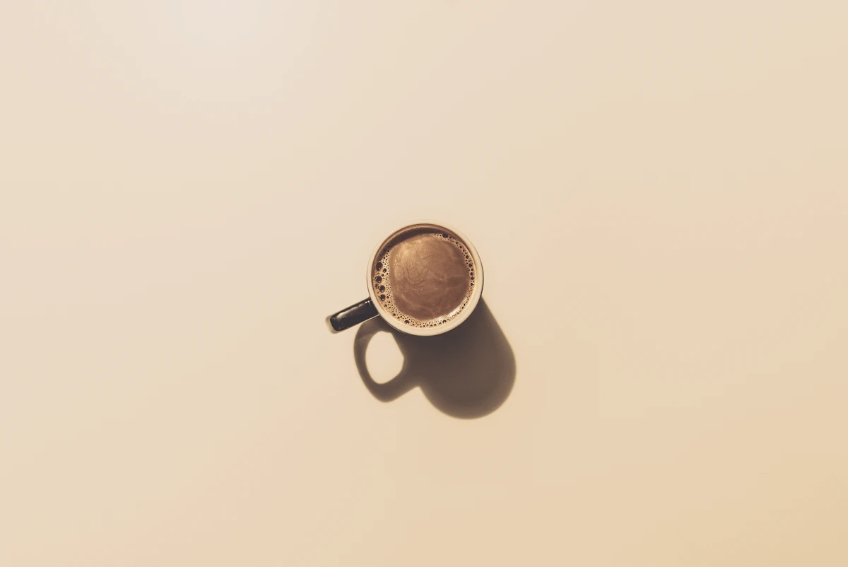 A warm cup of coffee on a calm morning table