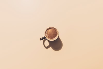 brown ceramic teacup minimal teams background