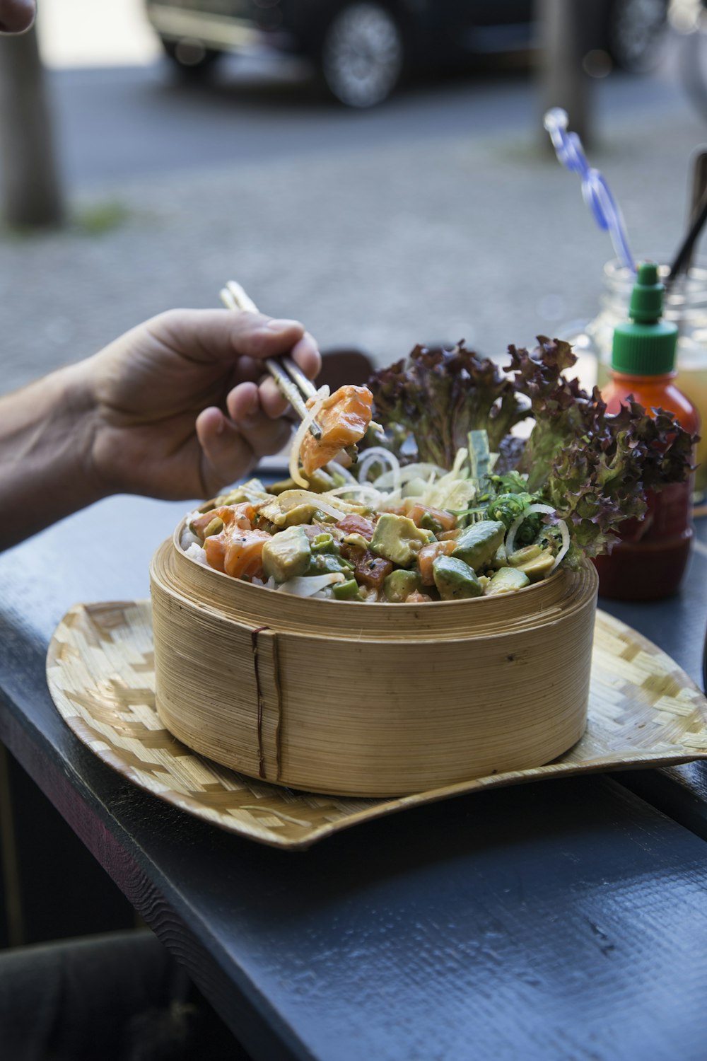 person eating with chopsticks