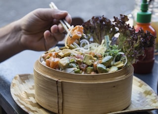 person eating with chopsticks