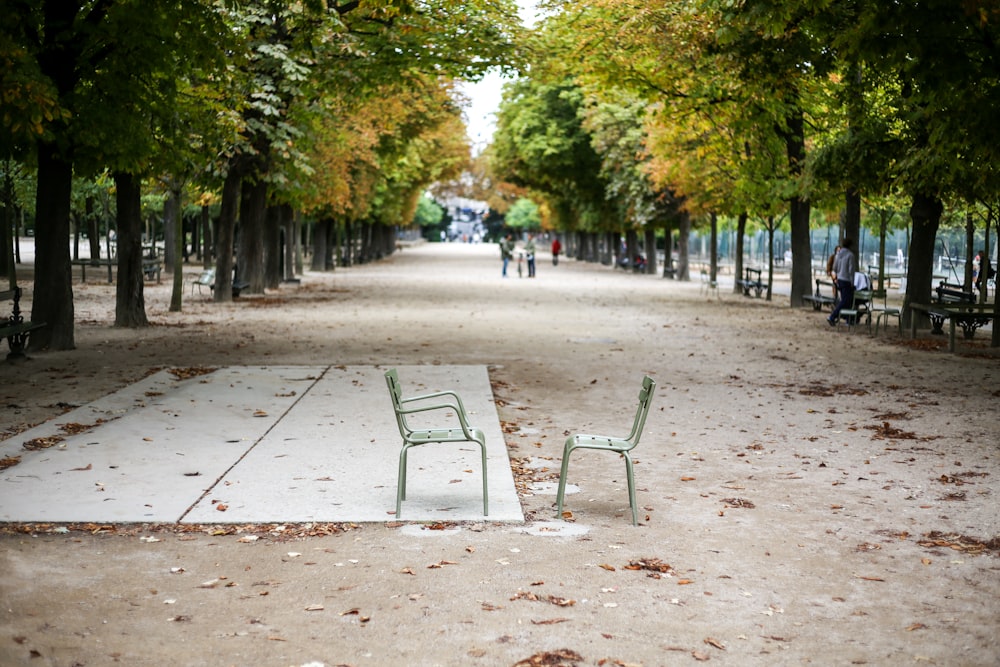 two gray chairs on road