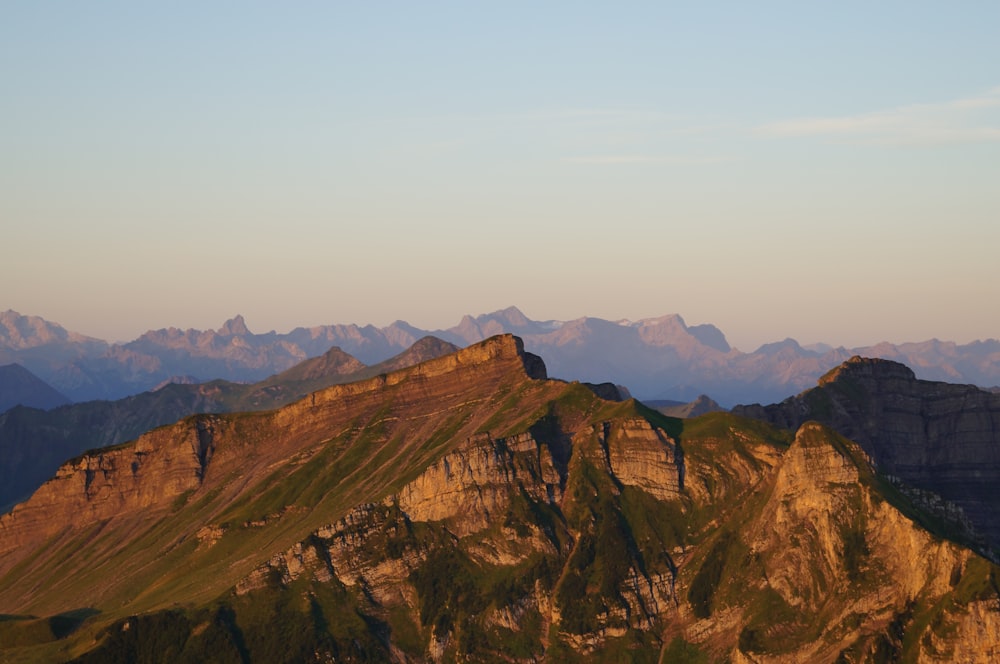 brown rock formation under blue sky