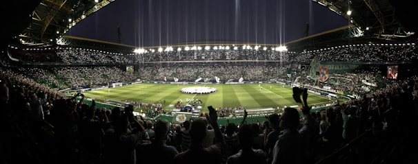 An intense stadium scene under night lights, capturing the energy of a Champions League game.