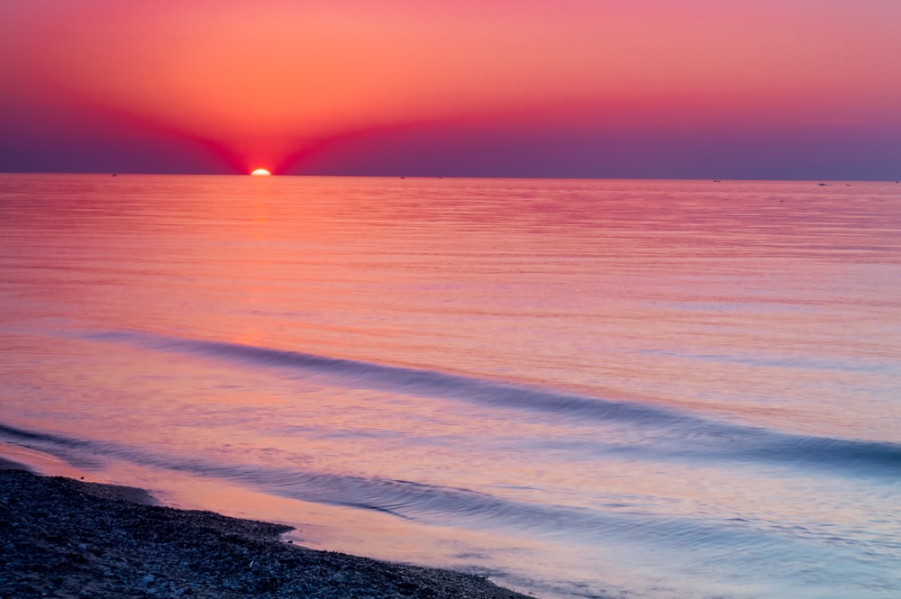 rippling body of water during golden hour