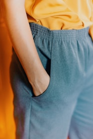 closeup photo of person hiding his right hand in his pocket