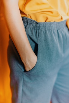 closeup photo of person hiding his right hand in his pocket