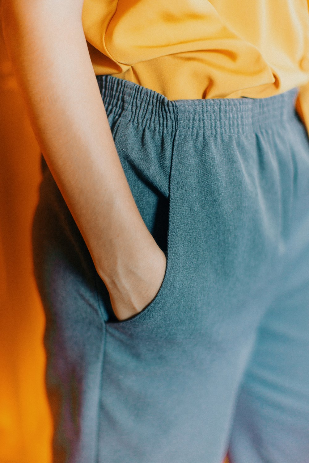 closeup photo of person hiding his right hand in his pocket