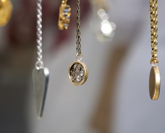 gold-and-silver-colored pendant necklace