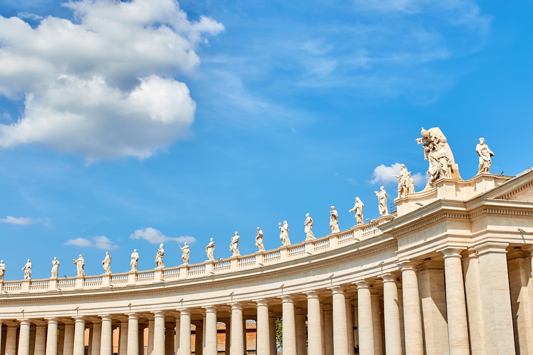 brown concrete palace under blue sky and white clouds, Vatican Sculptures