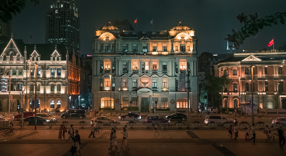 people walking in the street during nighttime