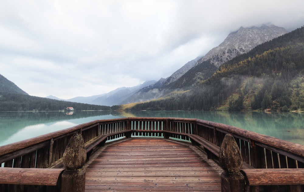 brown dock within mountain range during daytime