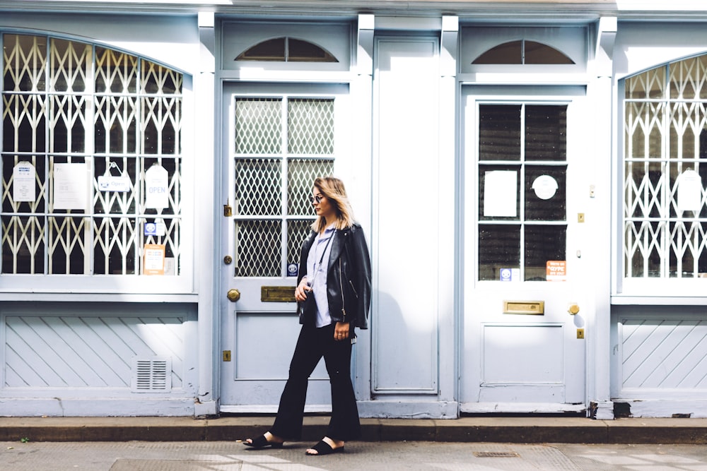 woman standing beside the door